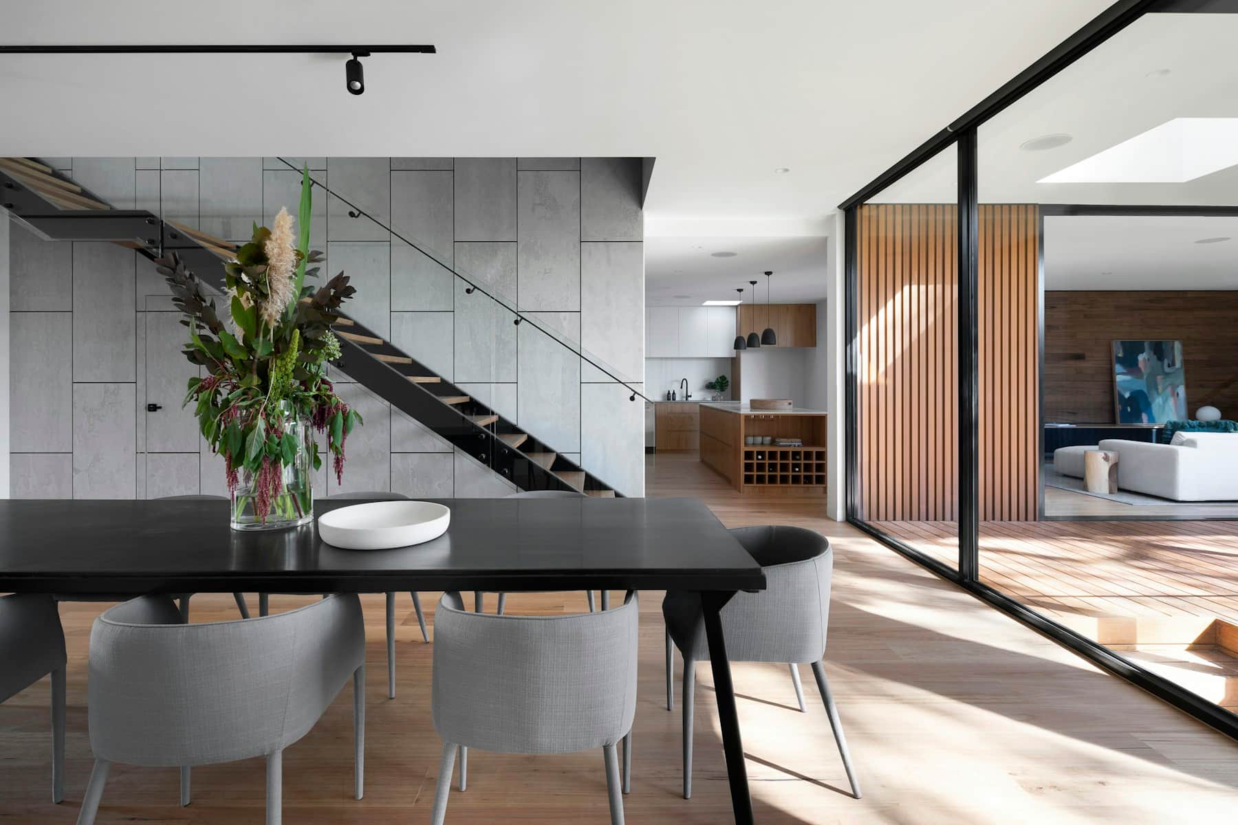 Large-format floor tile installed in a bright contemporary living room