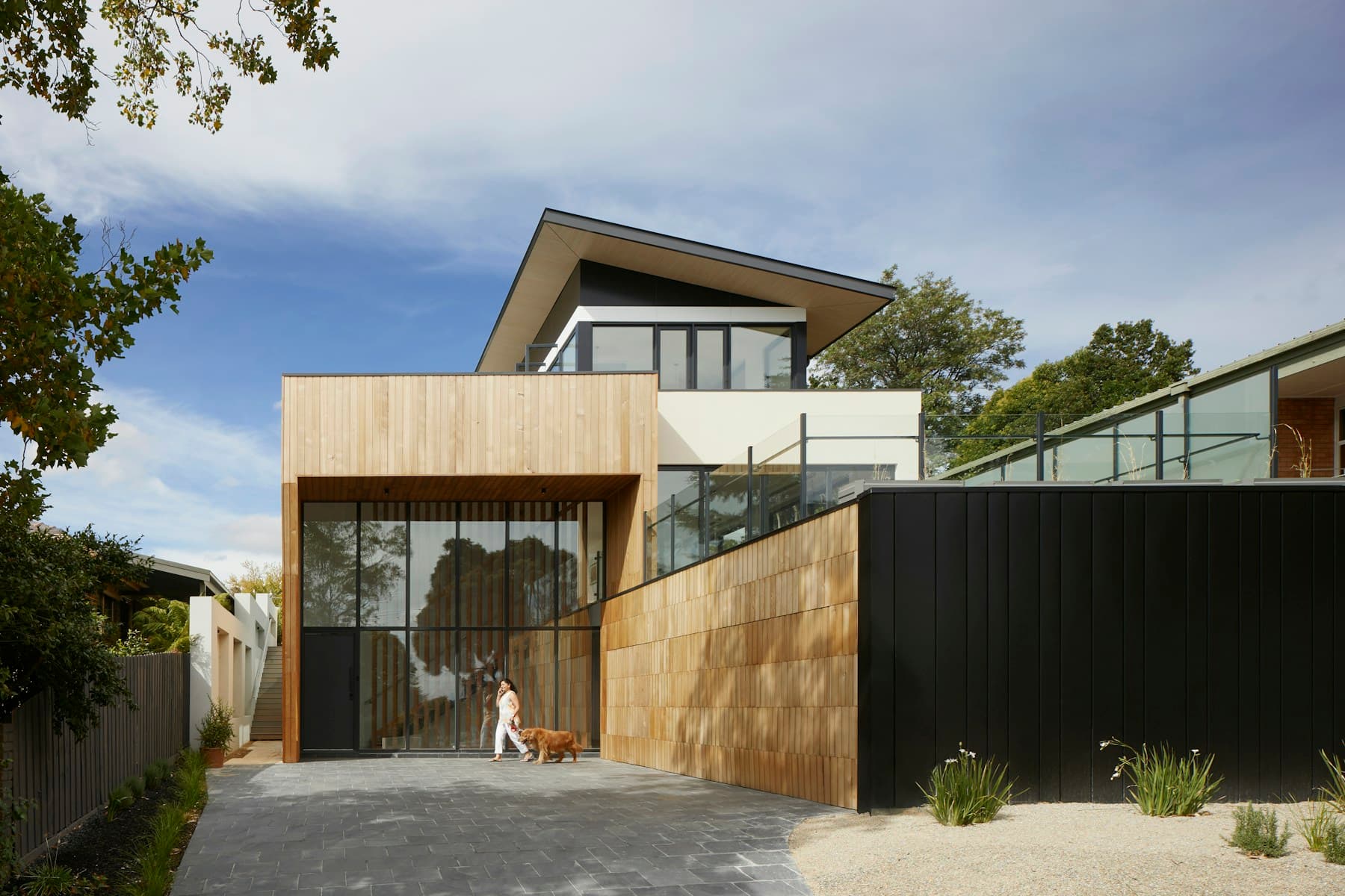 Contemporary interior finished with warm natural stone surfaces